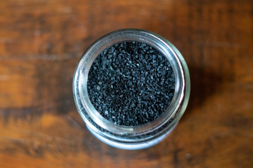 activated charcoal pieces in a mesh bag inside refrigerator