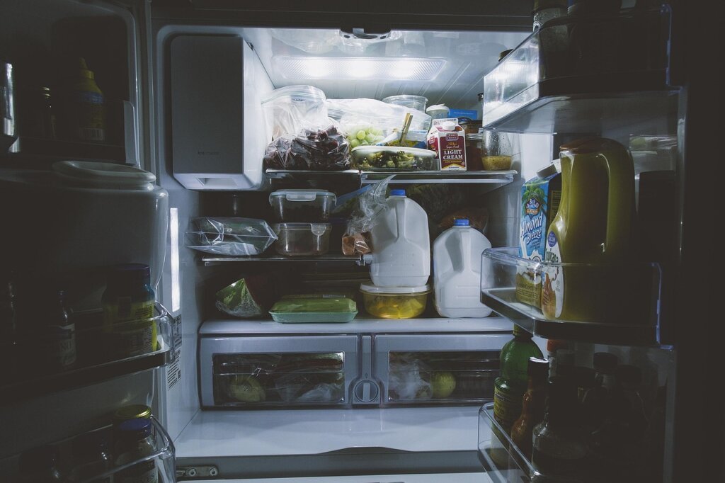 tidy and fresh clean refrigerator interior with organized food containers