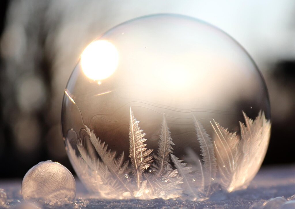 small dehumidifier placed near window with bubble wrap insulation in winter room