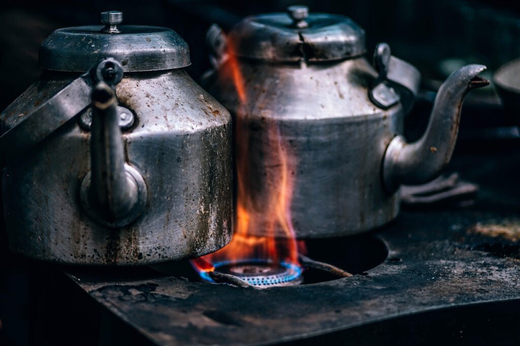 boiling water pot placed inside empty freezer for steam defrost