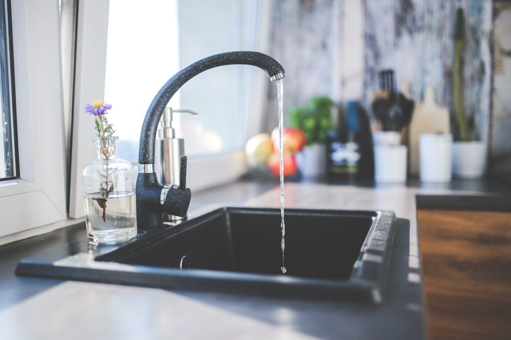 charcoal dehumidifier placed inside clean kitchen sink cabinet