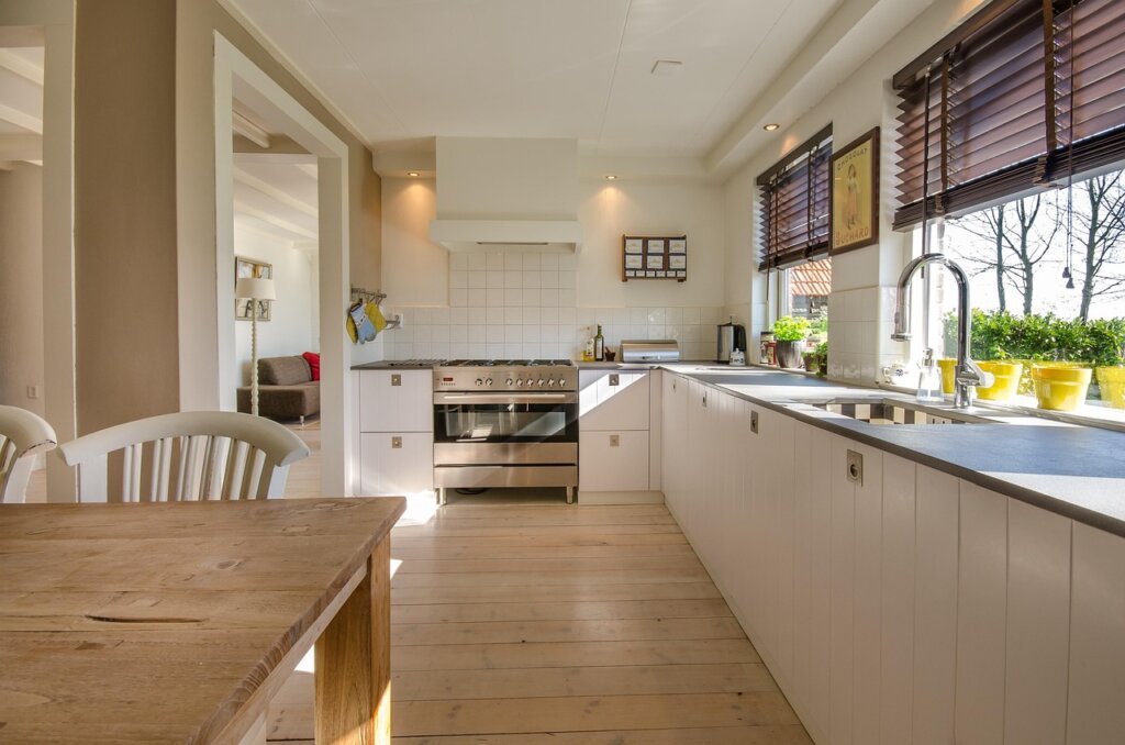 clean shiny stainless pot on kitchen counter with natural window light