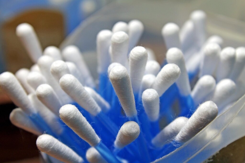 comparison of toothbrush cotton swab and cleaning stick on window sill