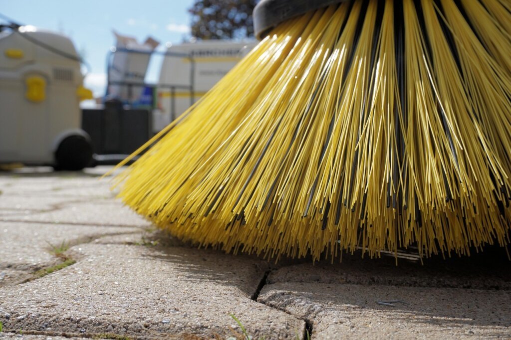 small brush sweeping window track dust