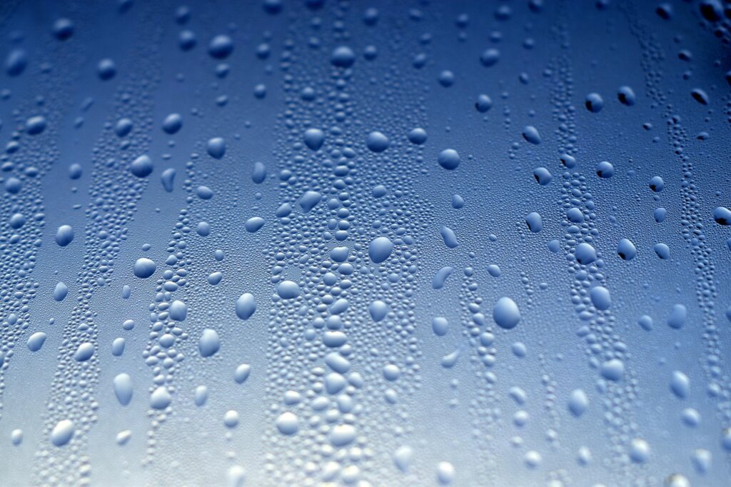 condensation water droplets on cold interior wall near window