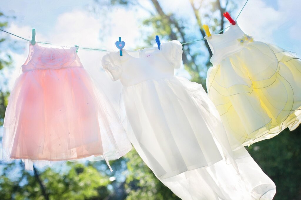 laundry rack with properly spaced clothes near window