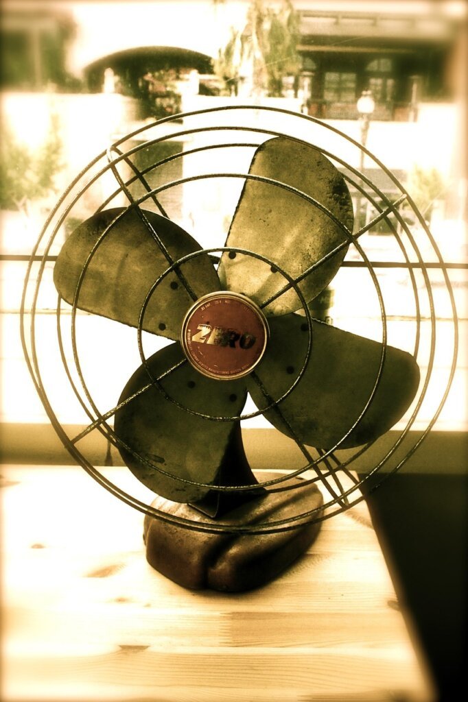 electric fan blowing air in a bedroom at night