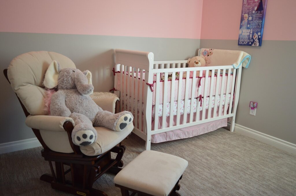 mosquito liquid vaporizer plugged into wall socket in a baby room