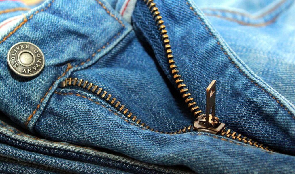 pliers gently squeezing zipper slider metal