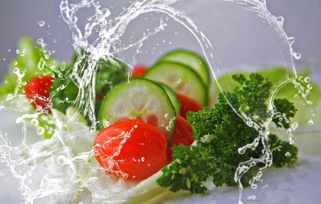 wrong refrigerator habits showing eggs on door rack and fruits mixed with vegetables