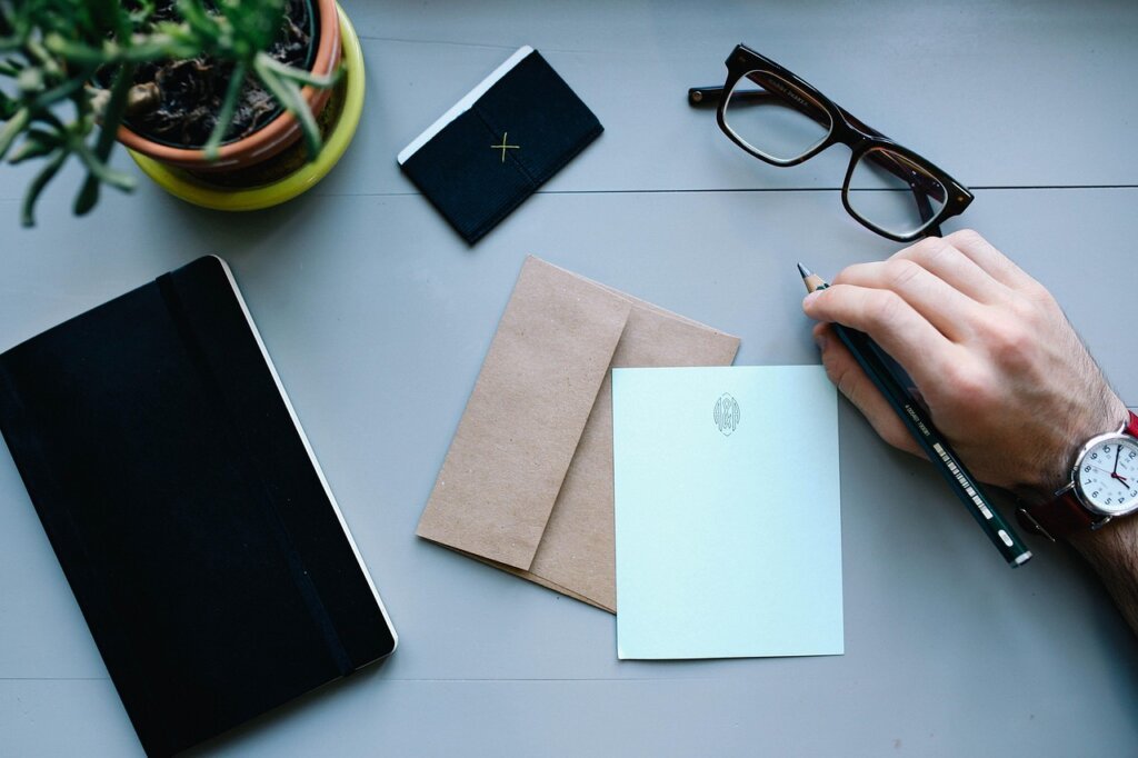 Korean man reviewing government welfare documents at home desk