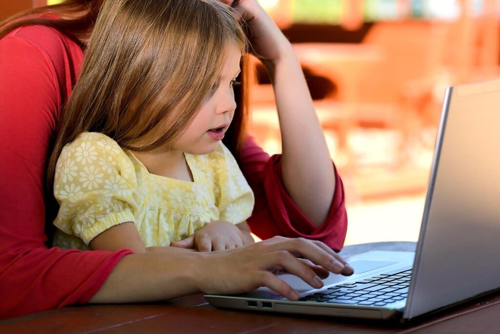 person applying for pet support on laptop at home