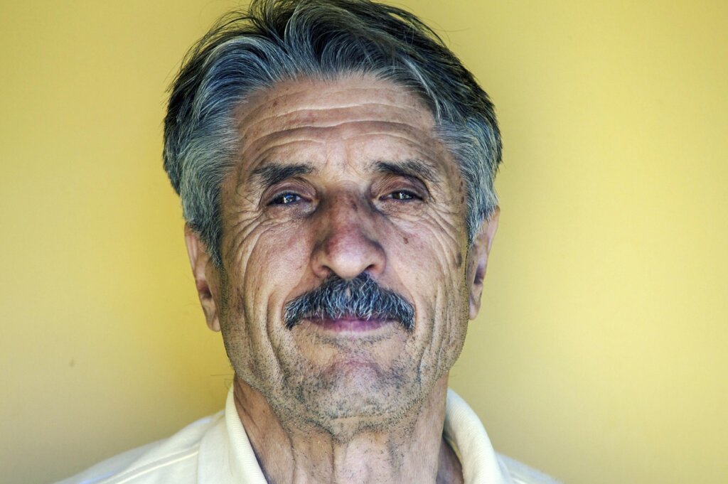 elderly man at audiology clinic receiving hearing test