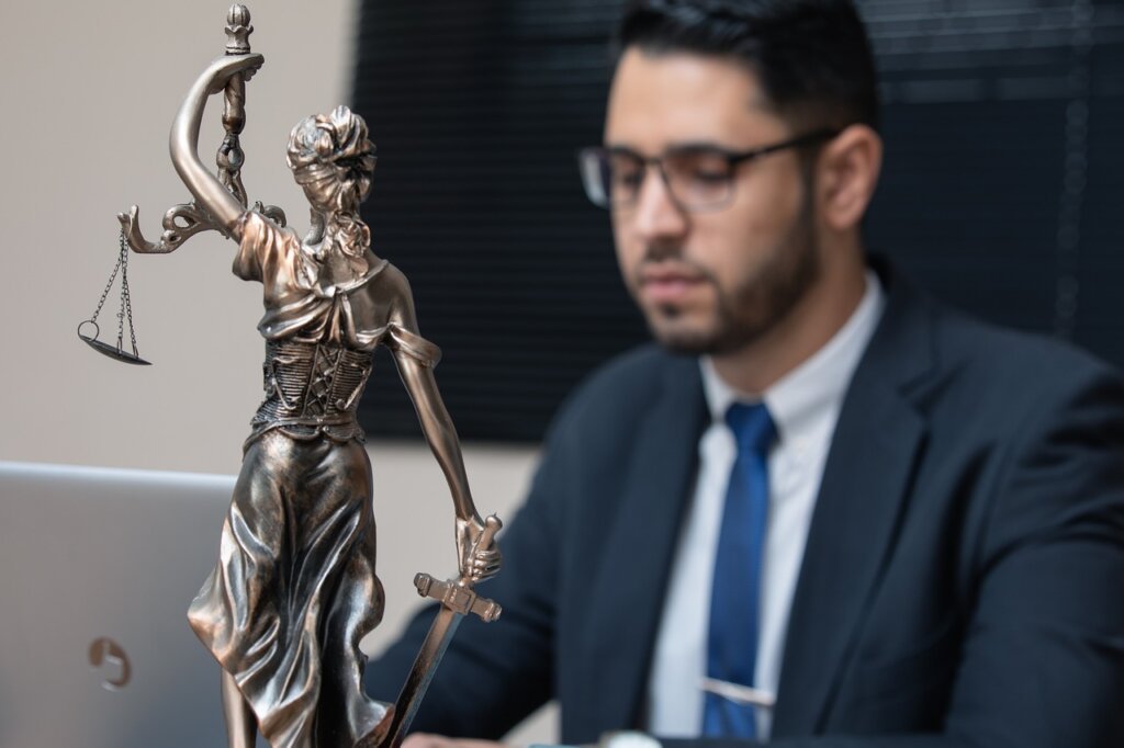 immigrant woman consulting with legal advisor at public legal aid office
