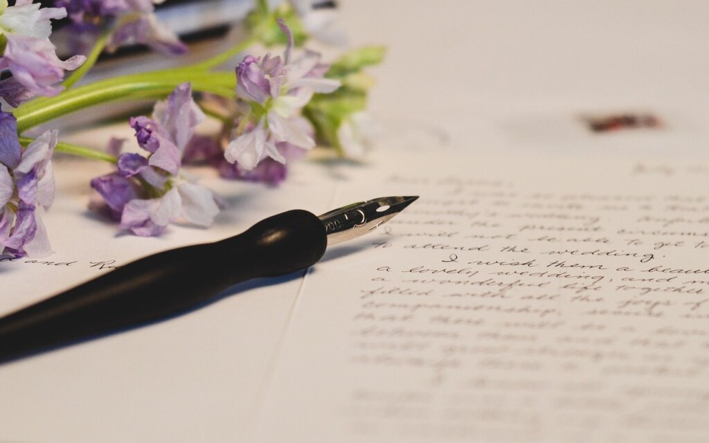 official government notice letter on desk with pen